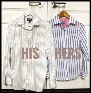 Striped cotton shirts on clothing hangers.